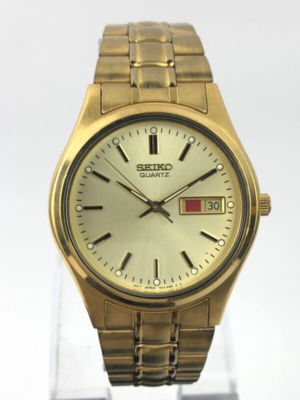 SEIKO QUARTZ ANALOG GOLD TONE CASE ALL ORI
