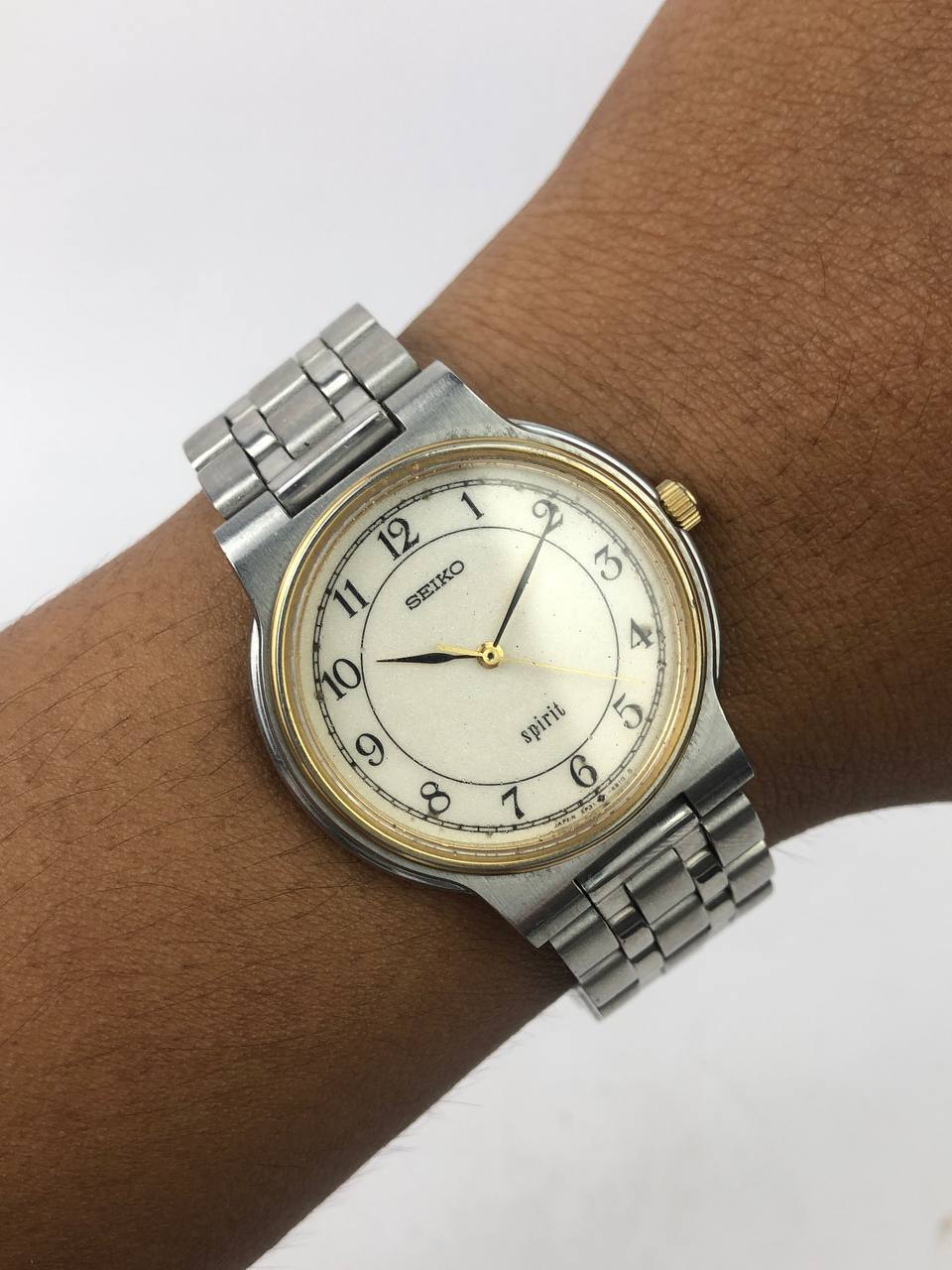 SEIKO SPIRIT ROUND TWO-TONE CASE STEEL BRACELET CREAM ARABIC DIAL
