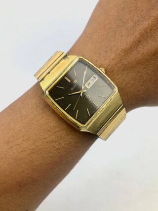 SEIKO QUARTZ DAYDATE BROWN DIAL