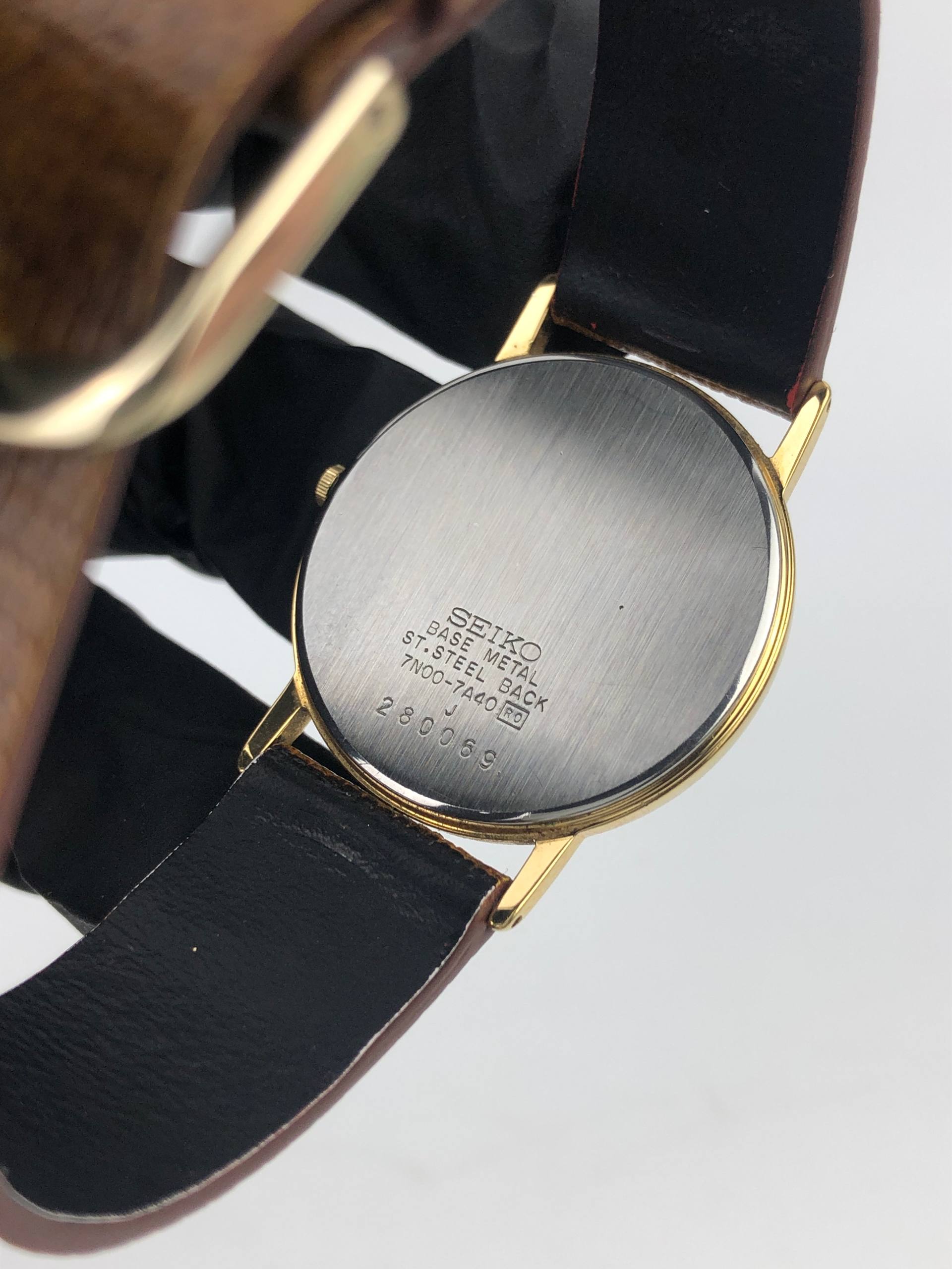SEIKO 7N00-7A40 QUARTZ ROMAN NUMERAL GOLD TONE CLASSIC - Gambar 7